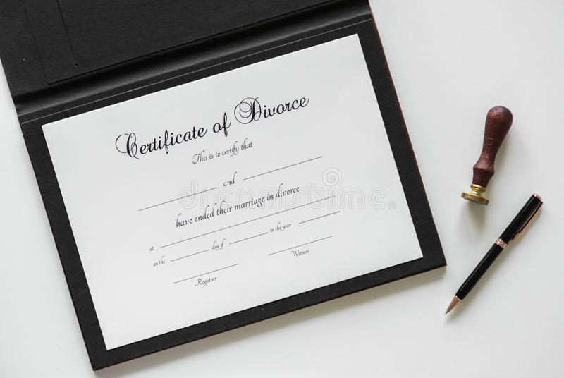 A close-up view of an official printed divorce registration certificate with government seals and formal text.